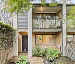 Private, Spacious Townhouse Living with Dual Courtyards & Double Ga... - Photo 6