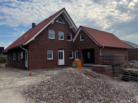 Neubauwohnung im Erdgeschoss mit großer Garage und Garten - Foto 4