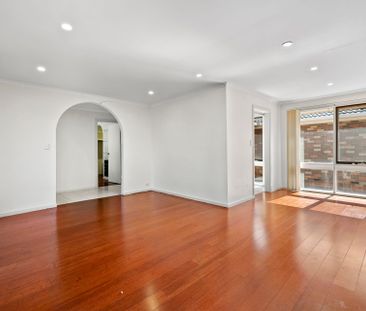 Spacious Four-Bedroom Home with Gardening Included - Photo 1