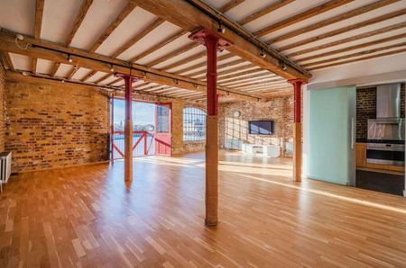 An exceptionally spacious 2 bedroom apartment situated on the second floor (with lift and stair access) of this fine, warehouse conversion, located in the heart of Wapping. - Photo 2