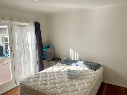 This is a FULLY FURNISHED one bedroom unit tucked away at the rear of the main house. - Photo 1