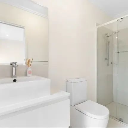 This stunning 3-bedroom, 2-bathroom townhouse in a boutique complex is now available for lease. - Photo 2