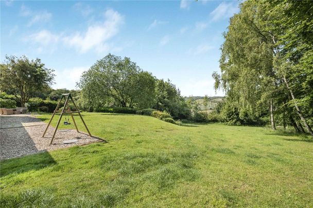 A comfortable and stylish five bedroom family home with wonderful views over the Stonor Valley, offering a maintained garden and is situated within close proximity of Henley-on-Thames. - Photo 1