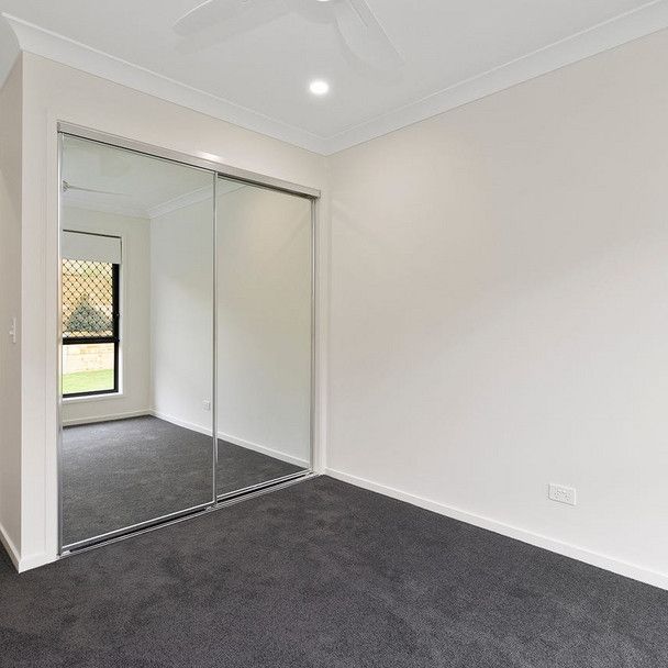 Stylish Family Living in Logan Reserve’s Growing Community - Photo 1