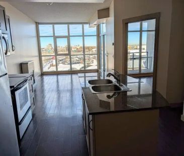 Top Floor 1-bedroom condo, floor to ceiling windows overlooking Dow... - Photo 1