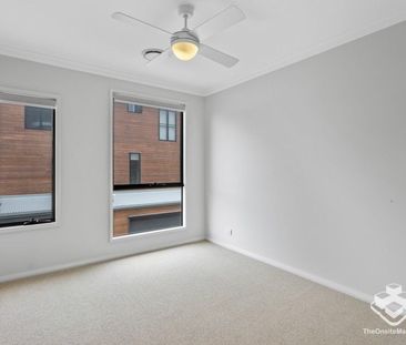 Stylish 4-Bedroom Townhome with Premium Features - Photo 2