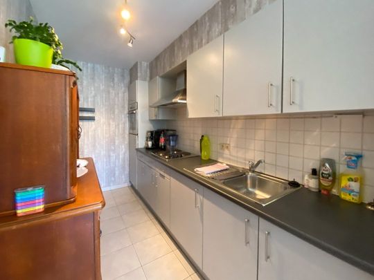 Gelijkvloerse appartement met 2 slaapkamers, tuin en garage. - Foto 1