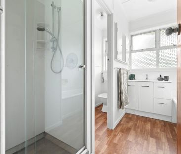 Step inside this three-bedroom home, where comfort meets convenience. - Photo 1