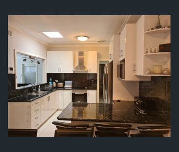 Family Home with Carport and Double Garage - Photo 5