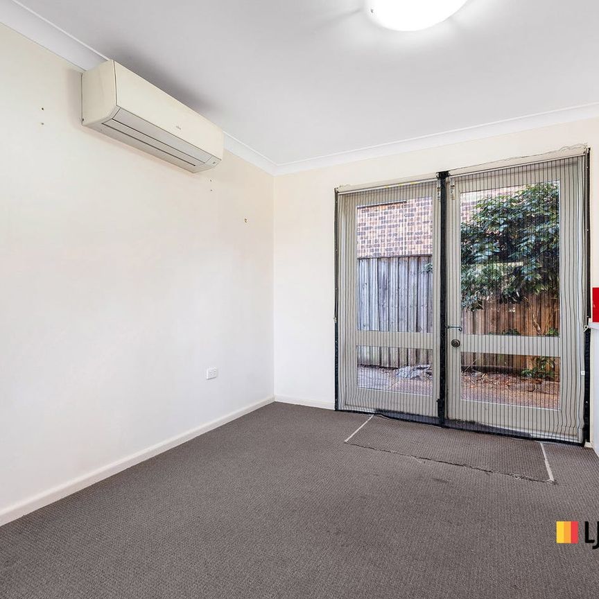 Spacious Two-Bedroom Townhouse in Peaceful, Convenient Location - Photo 1