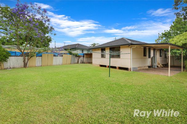 Neat 4 Bedroom Home with Comfort & Convenience - Photo 1