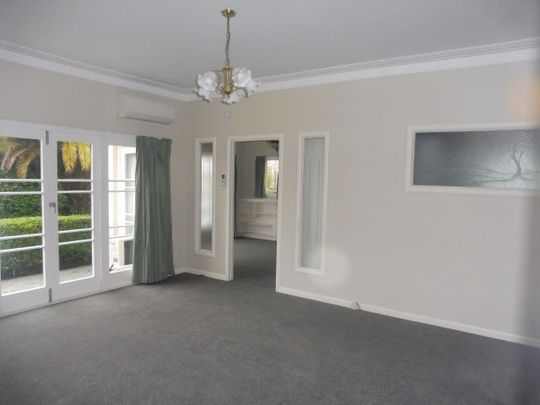 This tidy home at 16 MacDiarmid Road offers three spacious bedrooms, a modern kitchen, open-plan living, and a heat pump for year-round comfort. - Photo 1