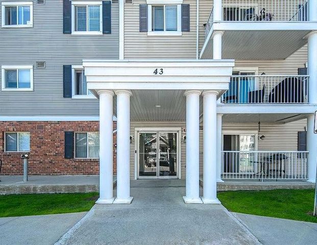 2 Bedrooms + 2 Full Bathrooms Condo Unit | 43 Country Village Lane Northeast, Calgary - Photo 1