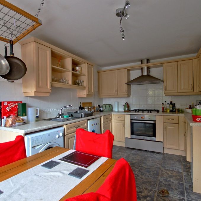 A mid terraced, three bedroom house, with garage and off road parking approximately four miles from Cambridge City Centre, Addenbrookes and the Train Station. - Photo 1