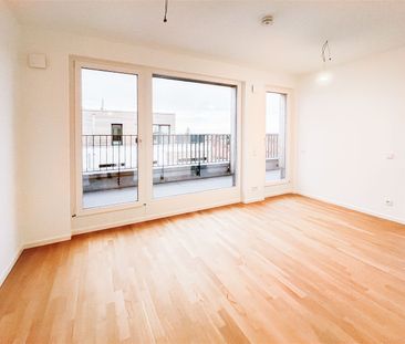 Moderne 2-Zi.-Wohnung mit großer Dachterrasse in schönem Neubauquar... - Foto 1
