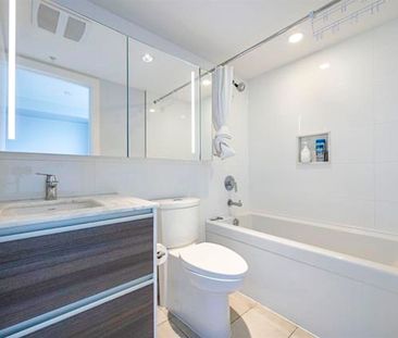 2 Bed Condo | Surrey University District | Parking • Den - Photo 2