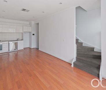 Open the Door to City Serenity with a Private Balcony - Photo 1