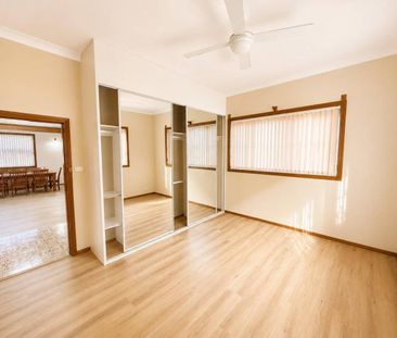 Spacious Family Home with Utilities & Lawn Maintenance Included - Photo 6