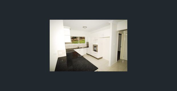 Elevated unit two bedrooms and two bathrooms undercover parking close to school, transport and shops - Photo 1