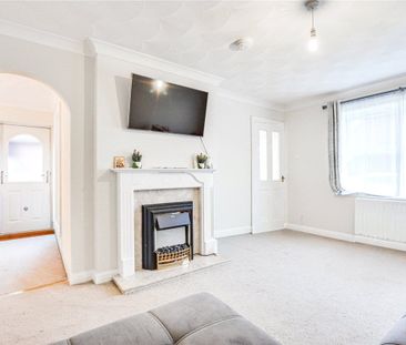 A 2 bedroom detached bungalow with a garage and driveway parking in... - Photo 1