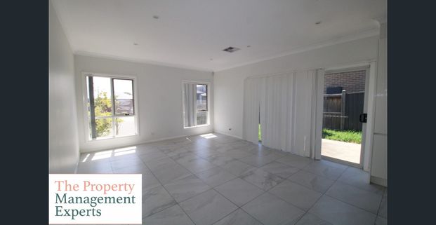 Spacious Four-Bedroom Family Home in a Prime Location! - Photo 1