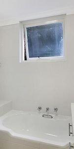 Ideally located two bedroom apartment with lock up garage - Photo 4