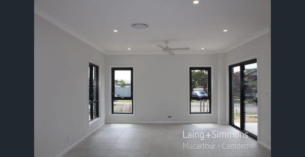 Brand New - 5 Bedroom + Multiple Living Areas - Photo 1
