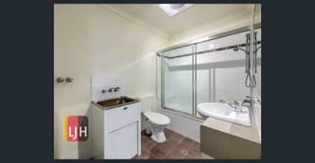 TOP FLOOR THREE BEDROOM UNIT WITH DOUBLE GARAGE & LARGE DECK! - Photo 2