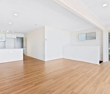 Two Bedroom Top Floor Unit in a Stunning Location with Water Views! - Photo 2