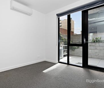 Stylish Two-Level Apartment with Two Outdoor Spaces! - Photo 2