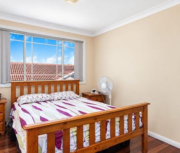 Spacious Family Home with Private Backyard & Double Garage - Photo 2
