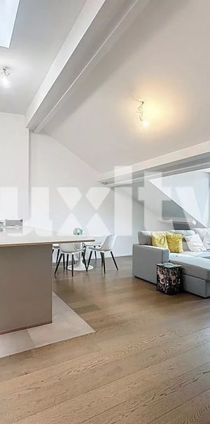 Renovated attic with modern comfort - Photo 1