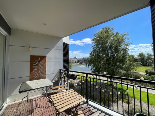 Perfectly Located with Reserve and Lake Frontage - Modern Stylish Living - Photo 1