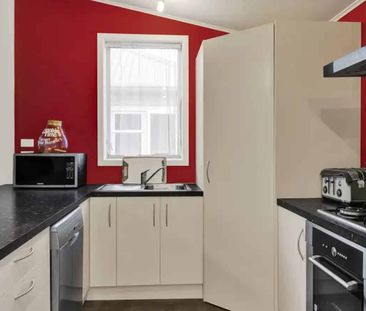 Tidy 3-Bedroom Home with Large Covered Deck - Photo 4