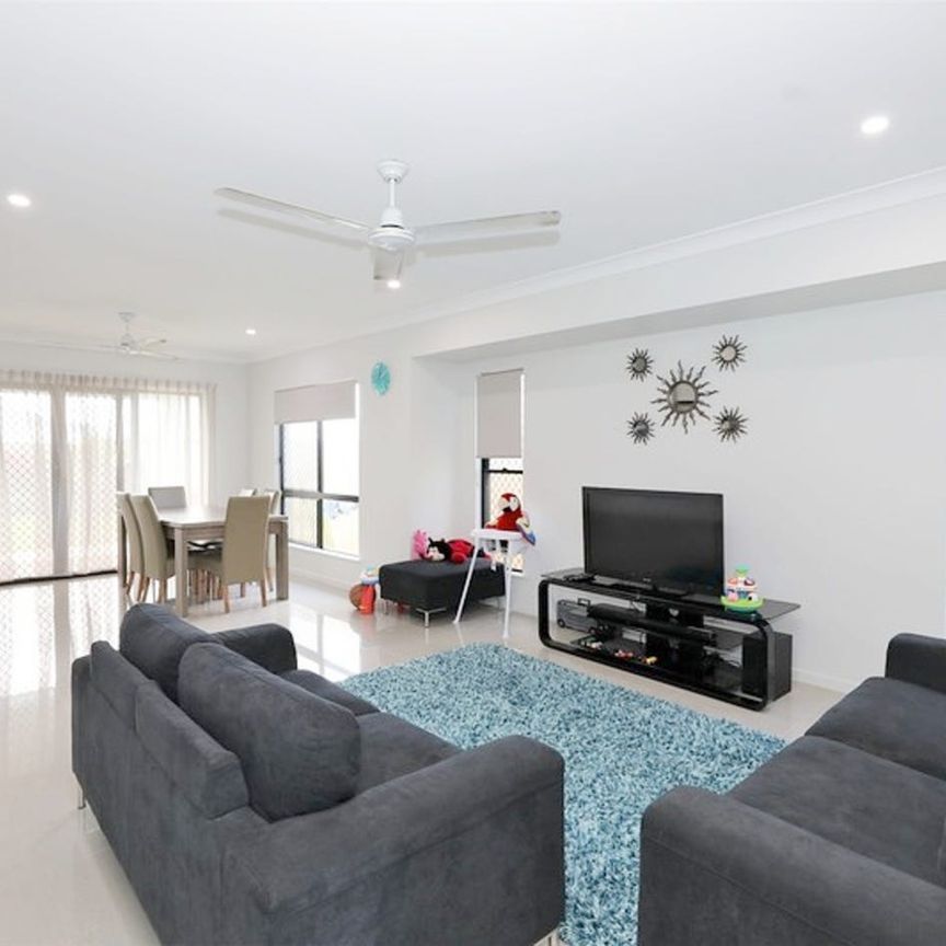 Modern Four-Bedroom Family Home in Prime Location - Photo 1