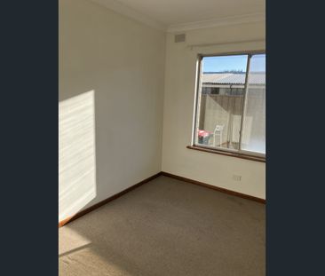 Two bedroom unit with secure garage and air conditioning - Photo 1