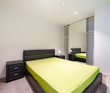 Open the Door to Effortless City Living with Stylish Furnished Comfort - Photo 4