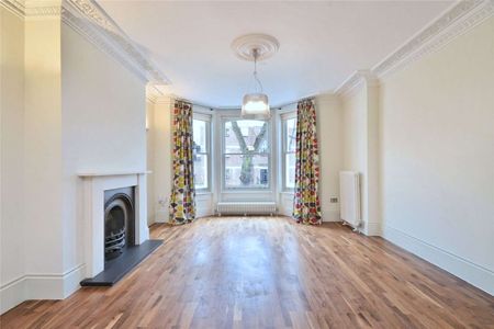 Located close to the amenities of Hampstead Heath is this five/six bedroom family home - Photo 4