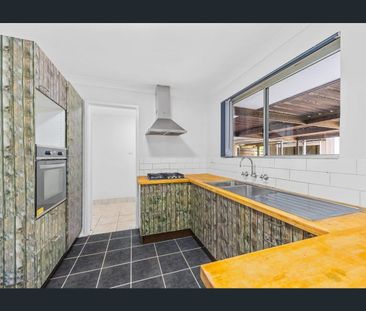 Neat, Updated Home with Large Driveway, Carport & Workshop - Photo 3