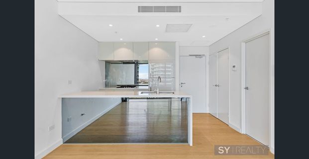 Luxury 1-Bedroom Apartment with Stunning Water Views + Parking - Photo 1