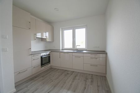 6476 - Moderne Obergeschosswohnung mit Einbauküche und Pkw-Stellplatz in zentraler Lage von WST! - Photo 5