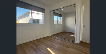 Brand New Stylish Four-Bedroom Home in Prime Location! - Photo 3