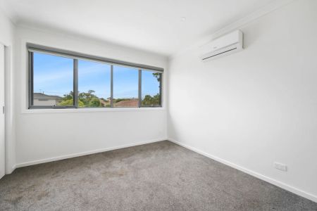 Stylish, Spacious Living with Modern Comfort Across Two Levels - Photo 3