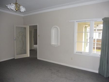 This tidy home at 16 MacDiarmid Road offers three spacious bedrooms, a modern kitchen, open-plan living, and a heat pump for year-round comfort. - Photo 3