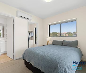 Modern Top Floor Unit - Offering Convenience and Style - Photo 3