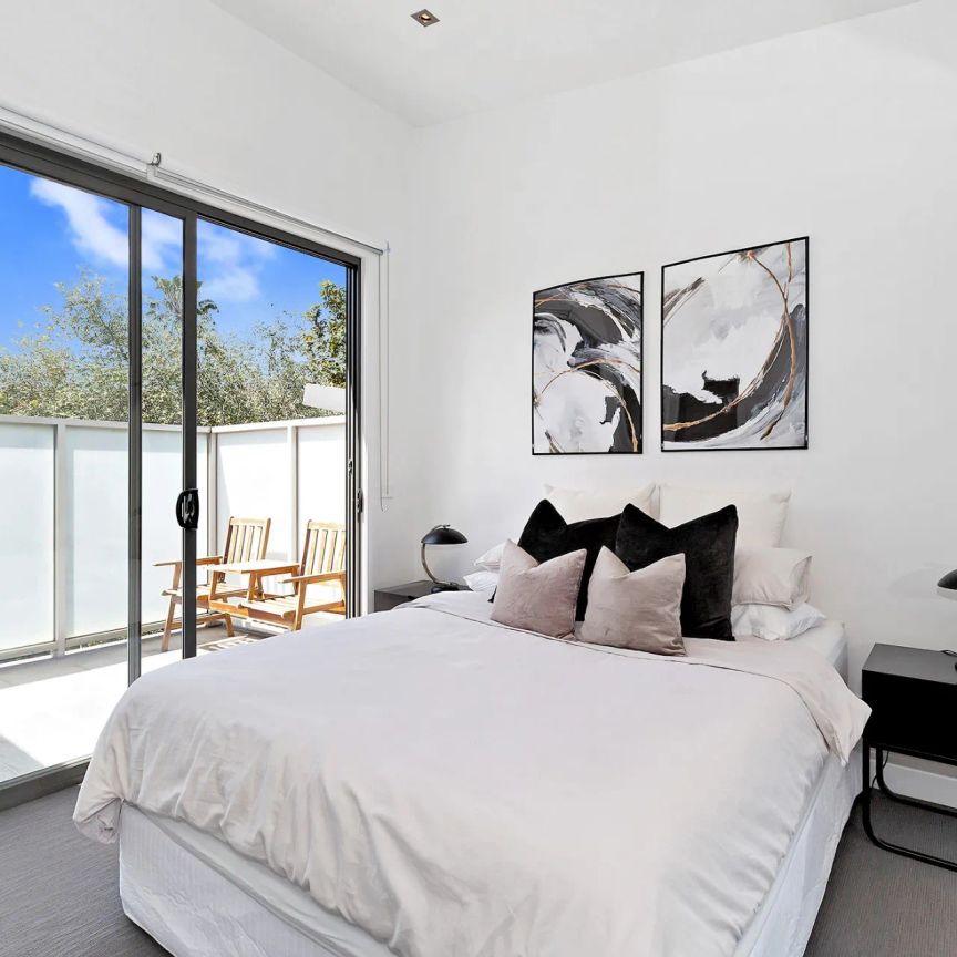 Striking Style, Sophisticated Living - Spacious Three-Level Townhouse! - Photo 1