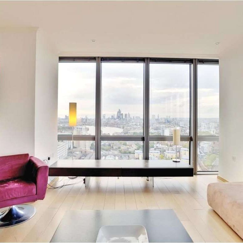 A luxury two-bedroom, two-bathroom apartment located on the 26th floor of No.1 West India Quay, E14, offering approximately 1,270 sqft of living space. - Photo 1