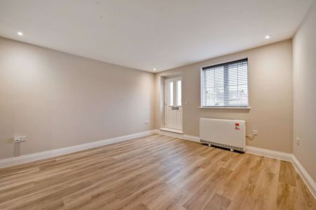 A newly converted two bedroom split level apartment located on the High Street. - Photo 2