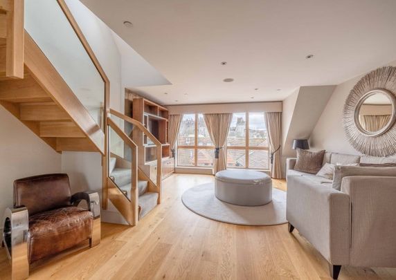 Elevate your lifestyle in this unique residence where modern sophistication meets historic charm. - Photo 1