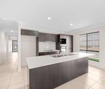 Stylish, Spacious, and Set to Impress - Welcome to 28 Liriope Drive! - Photo 2